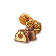 Chocolate truffles with nuts on a white background