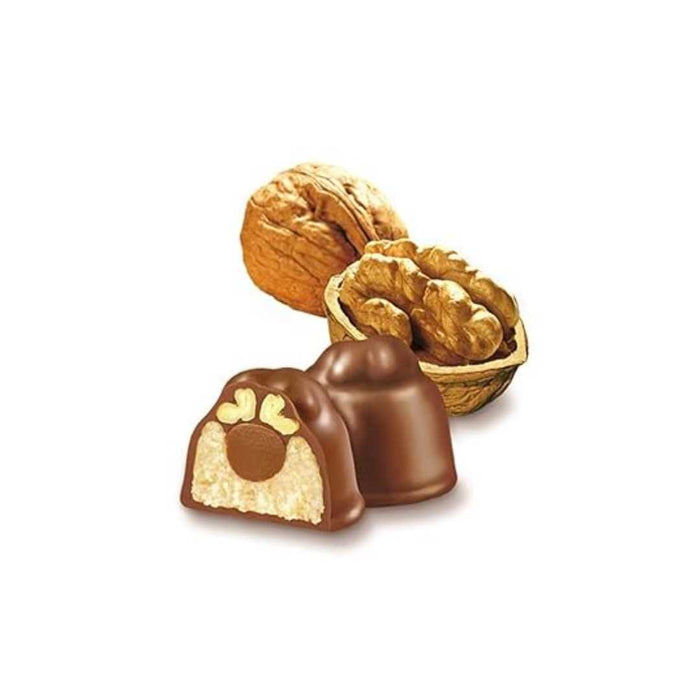 Chocolate truffles with nuts on a white background