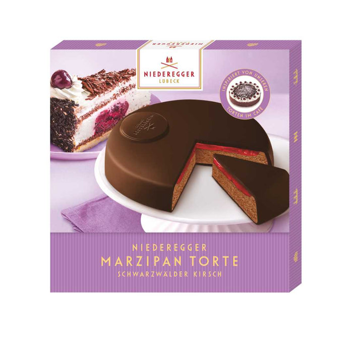 Niederegger Marzipan Torte packaging with a slice of cake on a white plate.