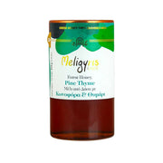 Jar of Meligyris Forest Honey with Pine Thyme on a white background